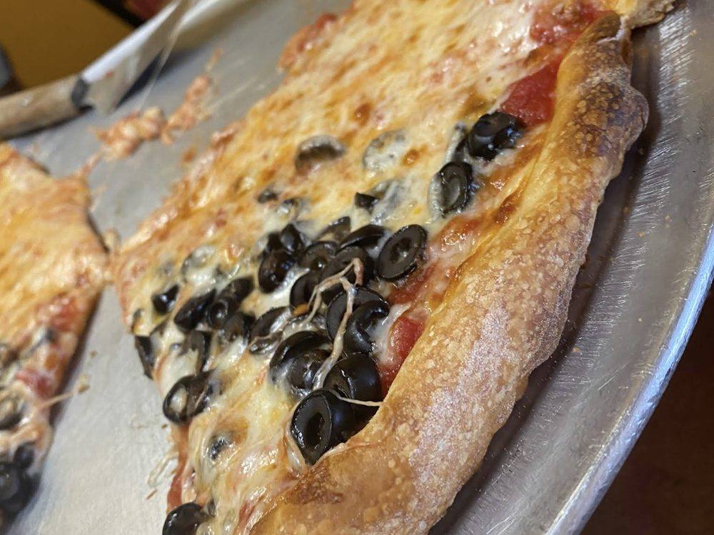 A loaded white slice, fresh from the oven