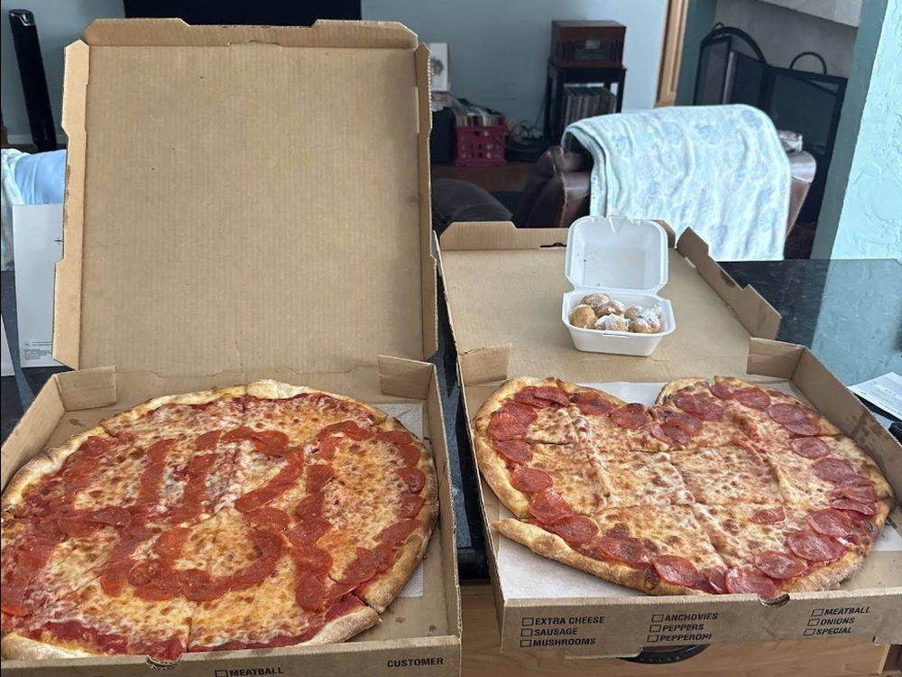 Two pies boxed up to go