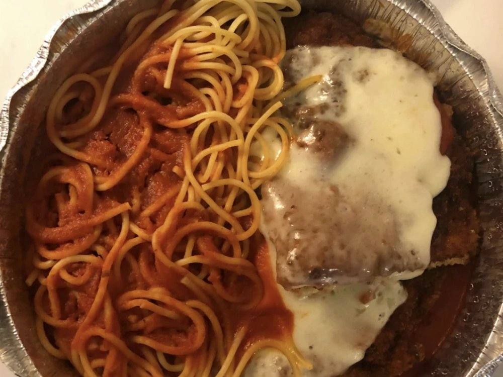 Chicken parmigiana over spaghetti, fresh from the kitchen